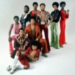 R & B group Earth Wind & Fire pose for a studio portrait circa the mid 1970s.